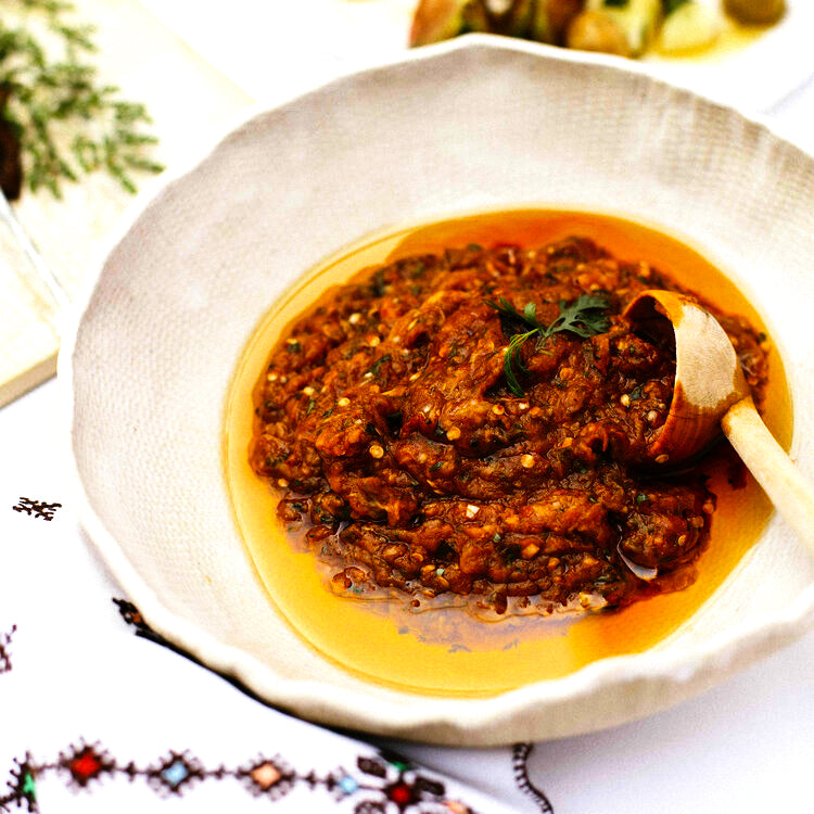Zaalouk in a serving bowl with serving spoon