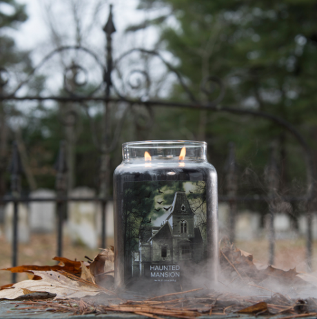 Spooky Halloween candle pictured in a cemetary